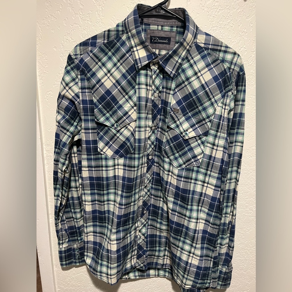This is a large blue white and green 7dimonds dress shirt and in good condition